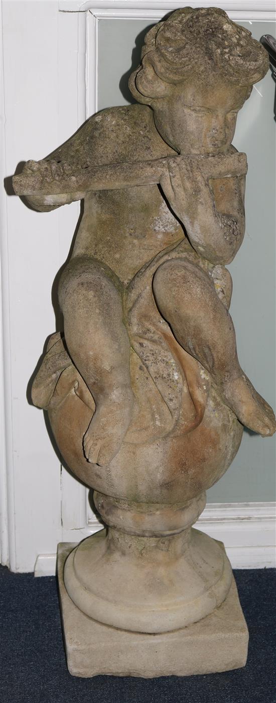 A pair of stone cherubs on balls H.107cm